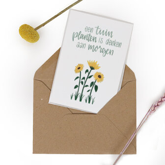 Bloemenzaden met kaart &#039;Een tuin planten is denken aan morgen&#039; verpakt in pergamijn zakje