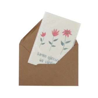 Bloemenzaden met kaart &#039;Samen groeien we verder&#039; verpakt in pergamijn zakje