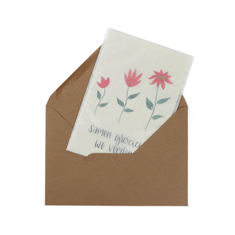 Bloemenzaden met kaart 'Samen groeien we verder' verpakt in pergamijn zakje